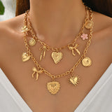💛 Collier Bohème Superposé  – Cœur, Soleil & Nœuds Dorés 2 pièces