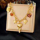 Collier Acier Inoxydable Doré – Fleur, Cœur & Soleil