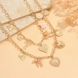 💛 Collier Bohème Superposé  – Cœur, Soleil & Nœuds Dorés 2 pièces