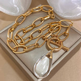 💛 Collier Vintage Goutte d’Eau en Acrylique – Chaîne Épaisse Dorée Tendance ✨